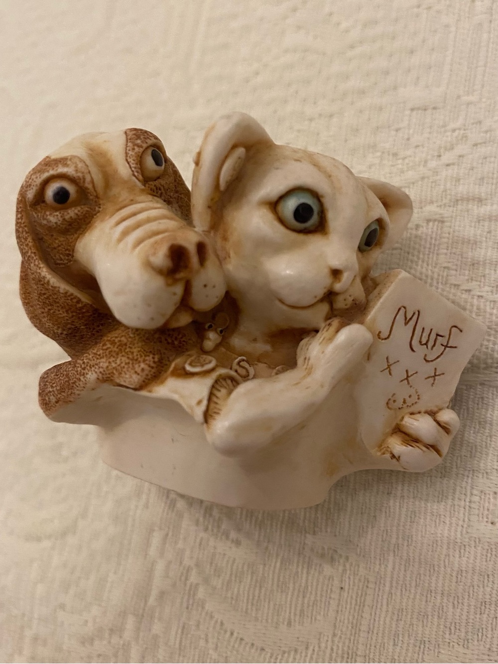 Harmony Kingdom “Signing Line” dog and cat figurine box top.